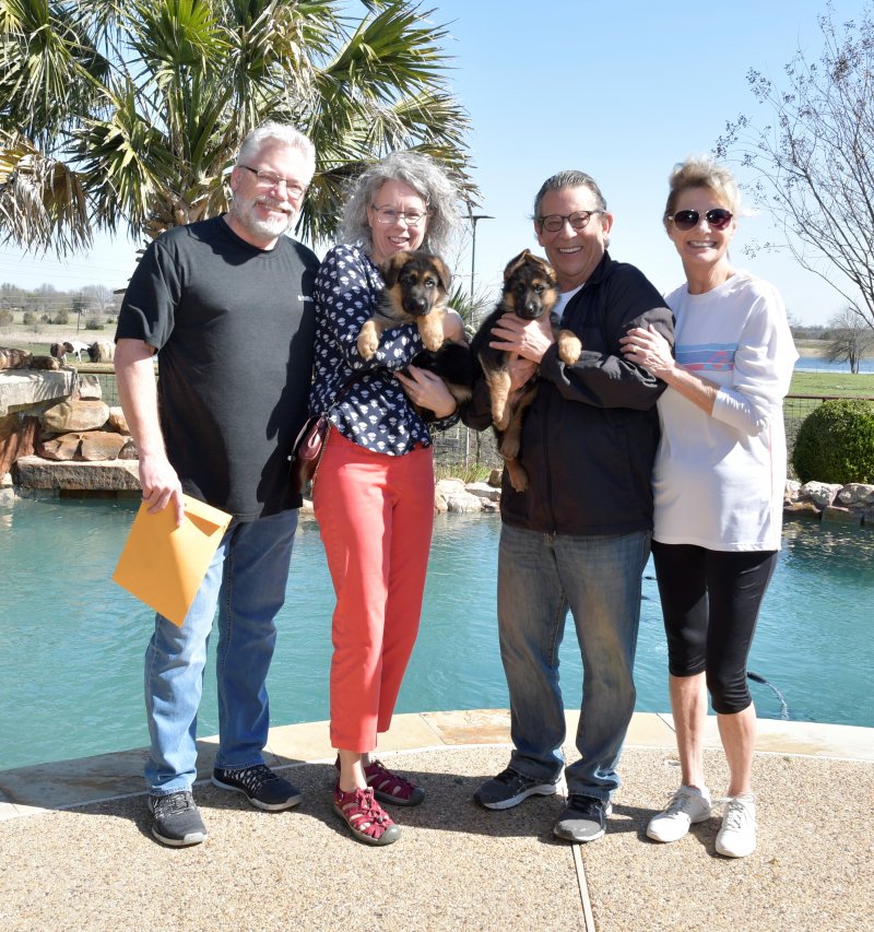Zuriel with his new owners Louis and Martha Felini and Heidi with her new owners Mike and Sharon Naftel. Picture taken on March 09, 2019